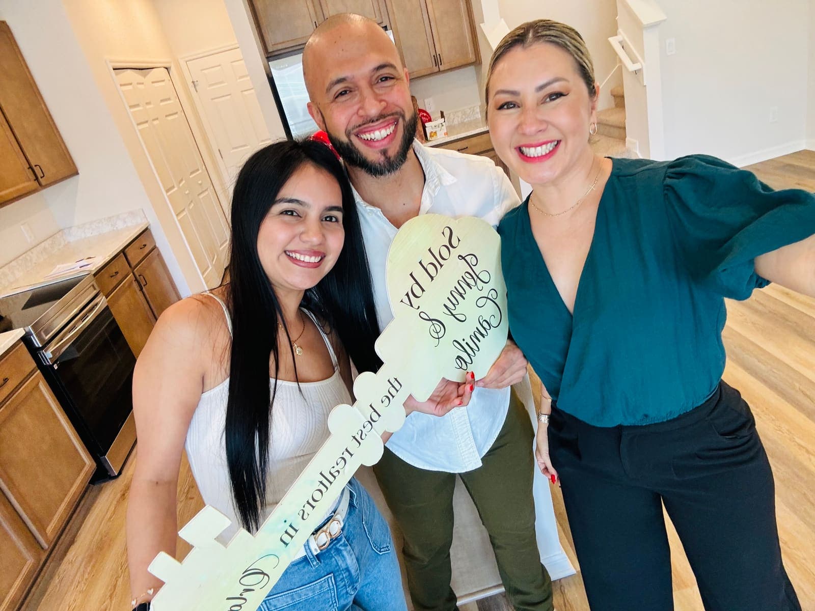 Clients gathered around the sold sign at their new Central Florida home